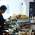 Seorang barista yang sedang membuat kopi di Trafique Coffee